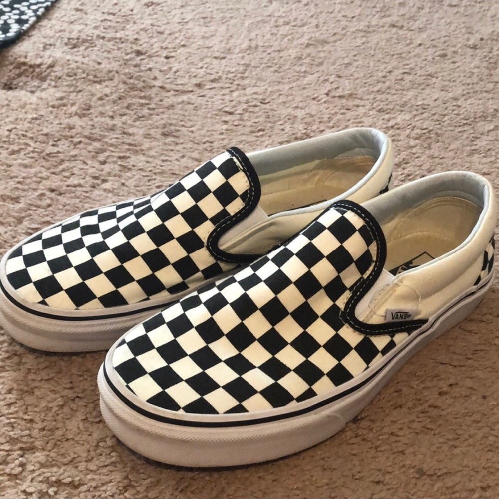 Checkered Vans slip-ons